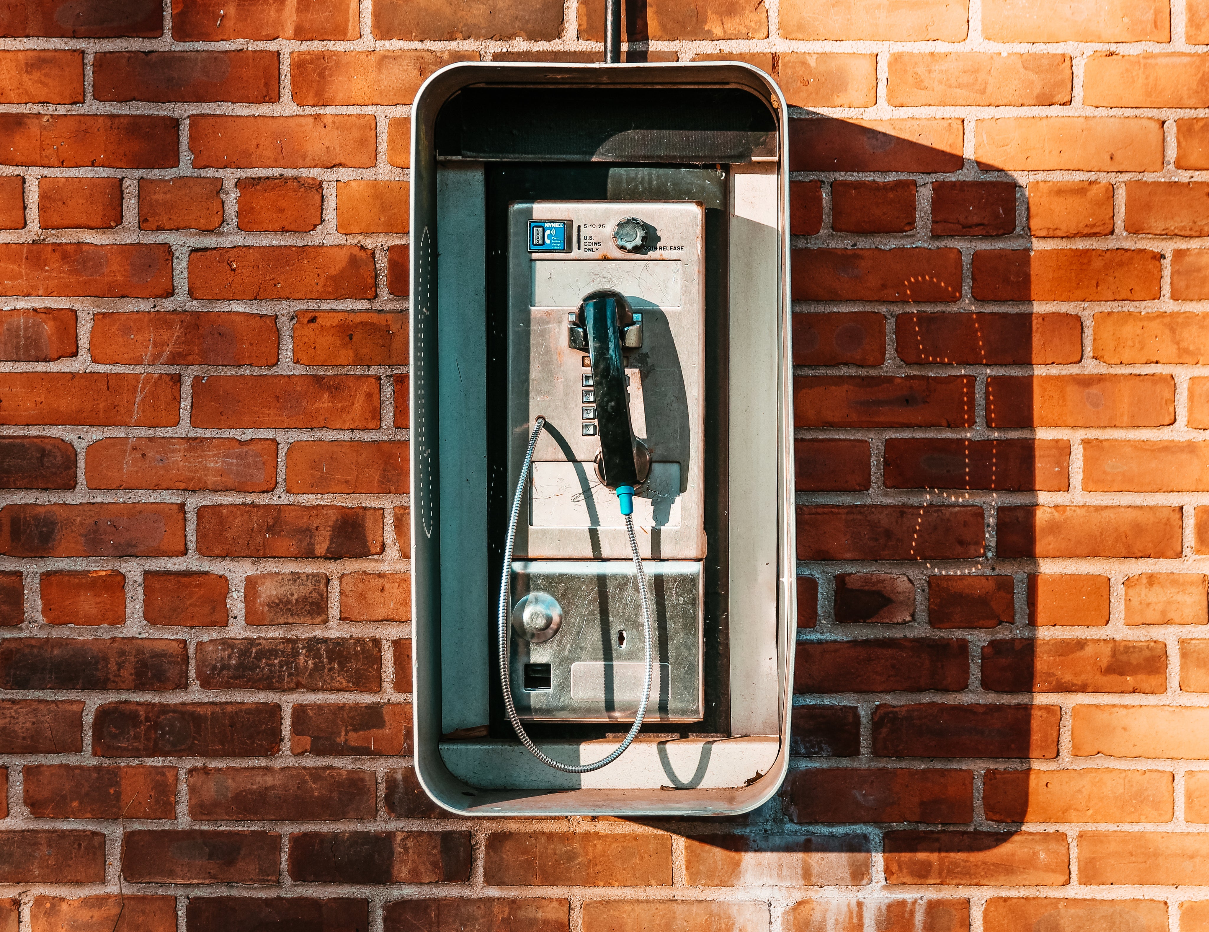 payphone-on-brick-wall.jpg